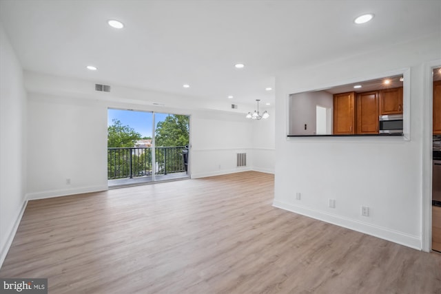 12001 Old Columbia Pike Unit 514, Silver Spring, MD 20904 - unfurnished living room with baseboards, light wood-type flooring, a chandelier, and recessed lighting