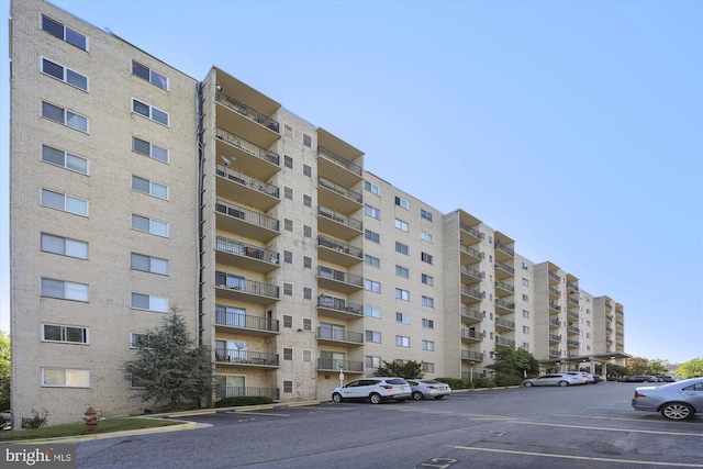 12001 Old Columbia Pike Unit 514, Silver Spring, MD 20904 - view of apartment building / complex featuring uncovered parking