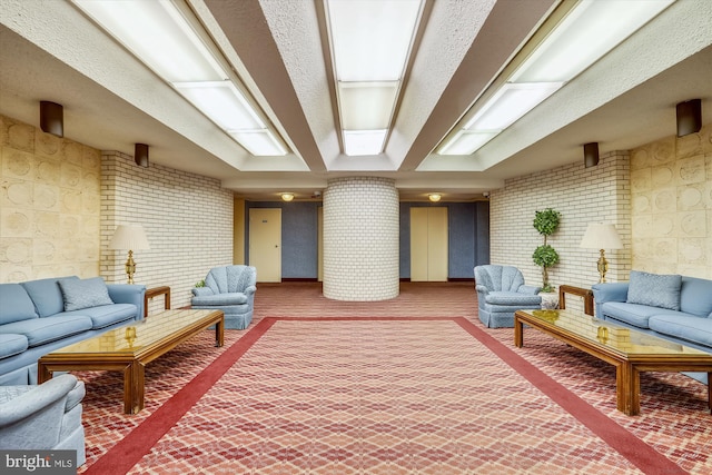 12001 Old Columbia Pike Unit 514, Silver Spring, MD 20904 - building lobby featuring brick wall and a textured ceiling