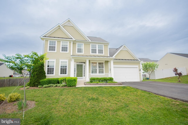 173 Tuscany Trl, Hedgesville, WV 25427 - view of front of property featuring asphalt driveway, an attached garage, covered porch, a standing seam roof, and metal roof