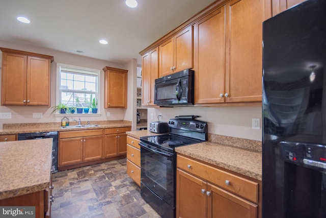 173 Tuscany Trl, Hedgesville, WV 25427 - kitchen featuring black appliances, a sink, recessed lighting, light countertops, and stone finish flooring