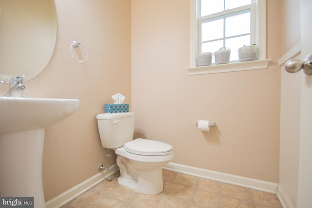 173 Tuscany Trl, Hedgesville, WV 25427 - half bathroom with toilet, baseboards, and tile patterned floors