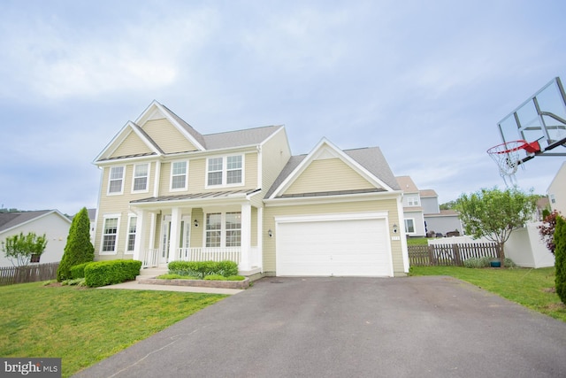 173 Tuscany Trl, Hedgesville, WV 25427 - view of front of property featuring a porch, asphalt driveway, an attached garage, a standing seam roof, and metal roof