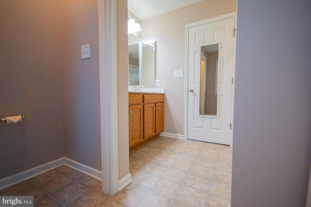 173 Tuscany Trl, Hedgesville, WV 25427 - bathroom with vanity, tile patterned flooring, and baseboards