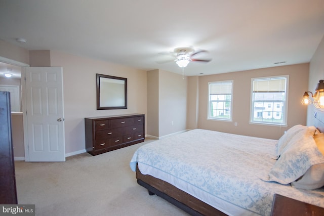 173 Tuscany Trl, Hedgesville, WV 25427 - bedroom with light carpet, baseboards, and a ceiling fan