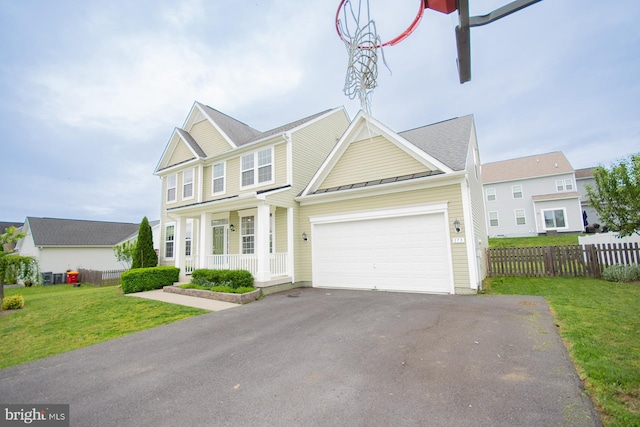 173 Tuscany Trl, Hedgesville, WV 25427 - view of front of property featuring a standing seam roof, a porch, driveway, metal roof, and a garage