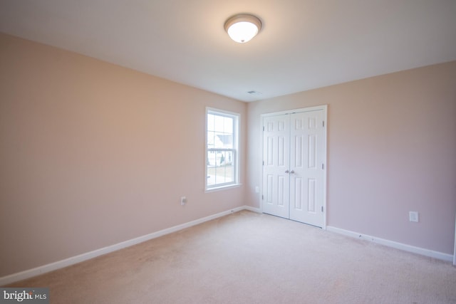 173 Tuscany Trl, Hedgesville, WV 25427 - unfurnished bedroom with light carpet, baseboards, and a closet
