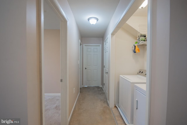 173 Tuscany Trl, Hedgesville, WV 25427 - laundry room with washing machine and dryer, light colored carpet, and baseboards