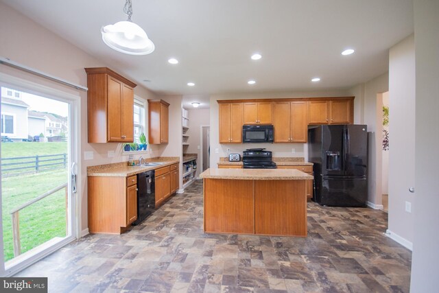 173 Tuscany Trl, Hedgesville, WV 25427 - kitchen featuring black appliances, a sink, light countertops, a kitchen island, and baseboards