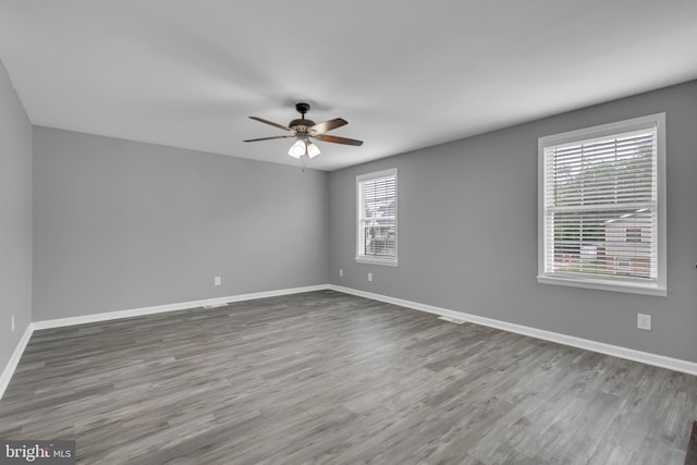 1223 Kendrick Rd, Baltimore, MD 21237 - empty room featuring healthy amount of natural light, a ceiling fan, and baseboards