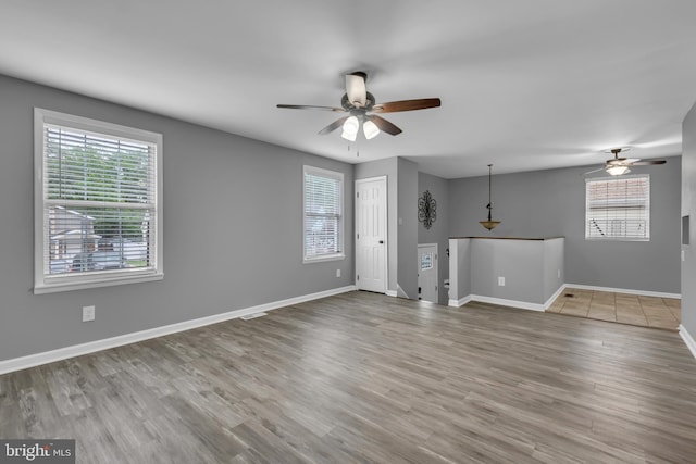1223 Kendrick Rd, Baltimore, MD 21237 - unfurnished living room with ceiling fan and plenty of natural light