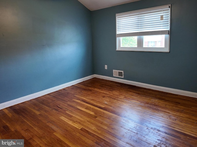 7849 Charlesmont, Dundalk, MD 21222 - unfurnished room with hardwood / wood-style flooring, baseboards, and vaulted ceiling