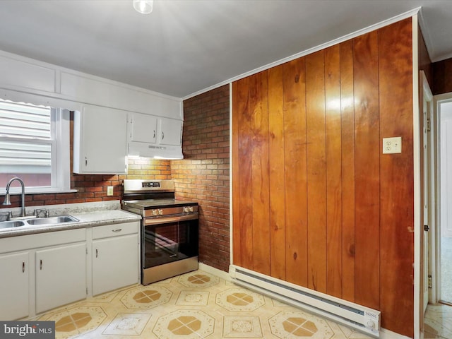 kitchen featuring electric stove, a sink, a baseboard heating unit, under cabinet range hood, and light countertops