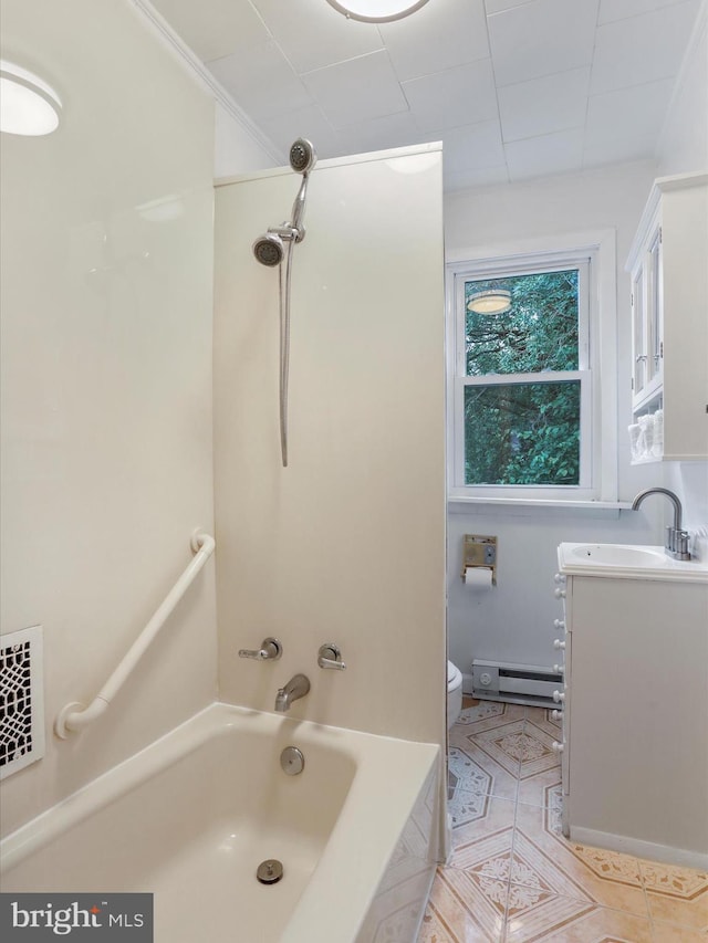 bathroom featuring baseboard heating, tile patterned floors, tub / shower combination, vanity, and toilet