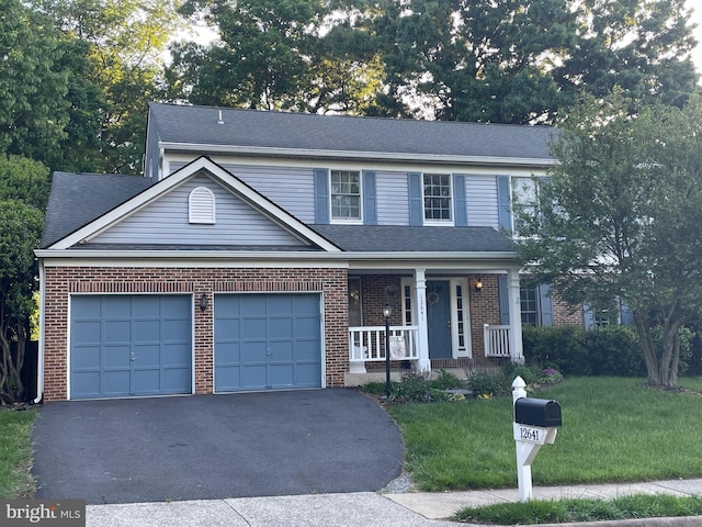 12641 Terrymill Dr, Herndon, VA 20170 - traditional-style house featuring covered porch, brick siding, an attached garage, a front lawn, and asphalt driveway