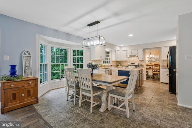12641 Terrymill Dr, Herndon, VA 20170 - dining space featuring a chandelier, baseboards, and recessed lighting