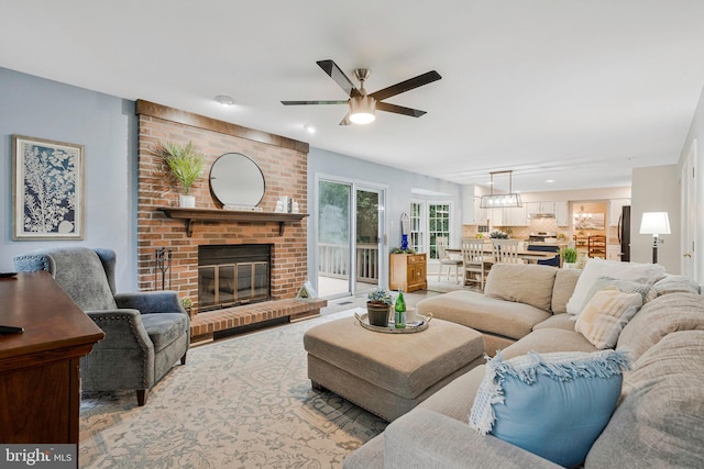 12641 Terrymill Dr, Herndon, VA 20170 - living area featuring ceiling fan, a fireplace, and recessed lighting