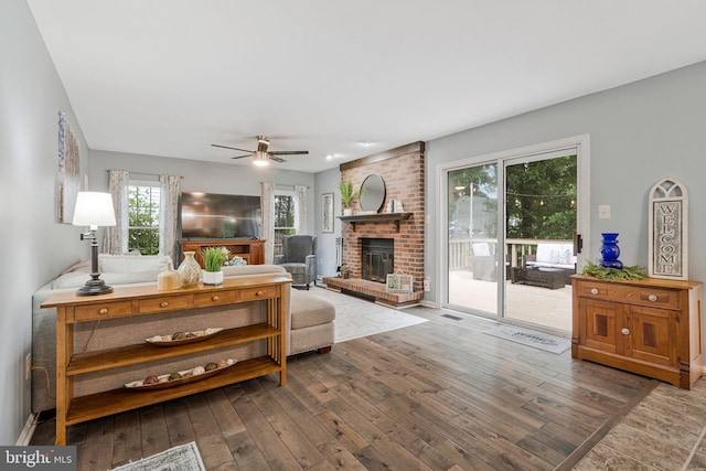 12641 Terrymill Dr, Herndon, VA 20170 - living area with hardwood / wood-style flooring, ceiling fan, and a fireplace