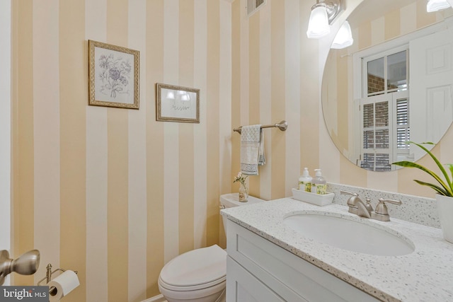 12641 Terrymill Dr, Herndon, VA 20170 - bathroom featuring wallpapered walls, toilet, and vanity