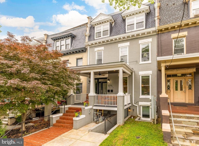 4324 14th St NW Unit 1, Washington, DC 20011 - view of property featuring mansard roof, brick siding, a porch, and a shingled roof