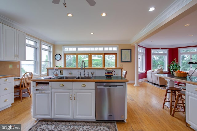 46369 Hattons Rest Ln, Lexington Park, MD 20653 - kitchen featuring stainless steel dishwasher, crown molding, a sink, white cabinets, and light wood finished floors