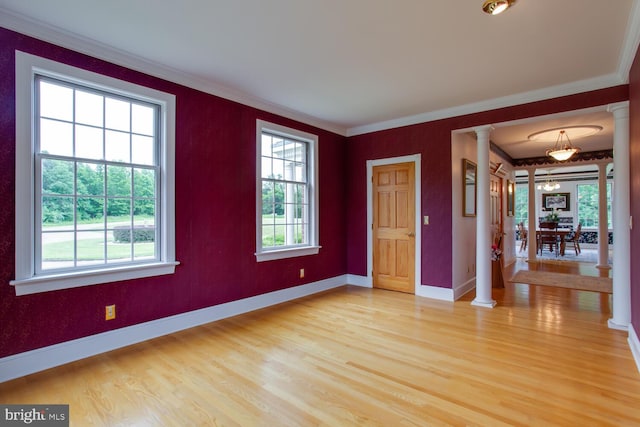 46369 Hattons Rest Ln, Lexington Park, MD 20653 - empty room featuring ornate columns, light wood-style floors, ornamental molding, and baseboards