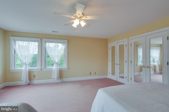 46369 Hattons Rest Ln, Lexington Park, MD 20653 - unfurnished bedroom featuring french doors, carpet flooring, multiple closets, and baseboards
