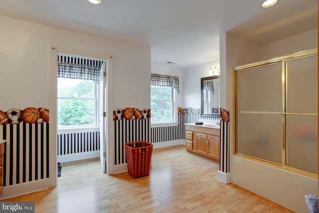 46369 Hattons Rest Ln, Lexington Park, MD 20653 - full bathroom featuring vanity, wood finished floors, shower / bath combination with glass door, recessed lighting, and baseboards