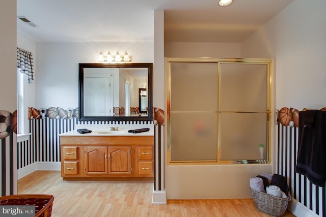46369 Hattons Rest Ln, Lexington Park, MD 20653 - bathroom featuring vanity, wood finished floors, and enclosed tub / shower combo