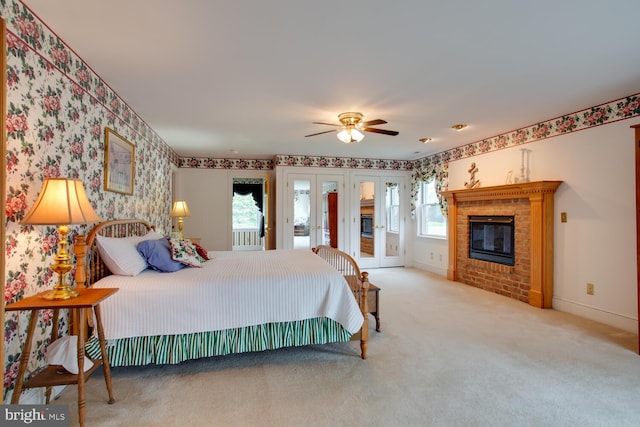 46369 Hattons Rest Ln, Lexington Park, MD 20653 - carpeted bedroom featuring access to exterior, wallpapered walls, french doors, multiple windows, and a brick fireplace