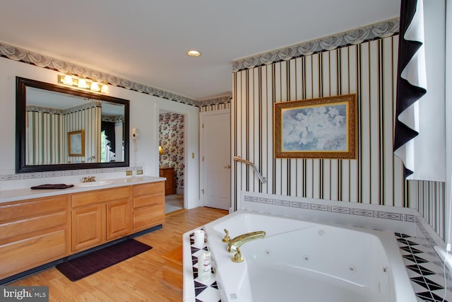 46369 Hattons Rest Ln, Lexington Park, MD 20653 - full bathroom featuring a jetted tub, vanity, wallpapered walls, and wood finished floors