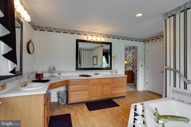 46369 Hattons Rest Ln, Lexington Park, MD 20653 - full bath featuring two vanities, a bath, wood finished floors, and recessed lighting