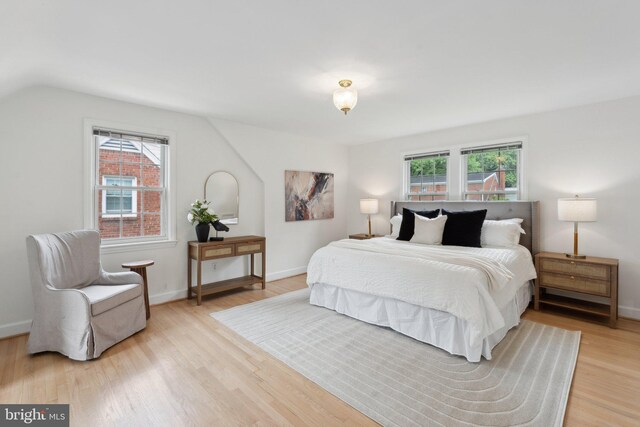 1725 Oakcrest Dr, Alexandria, VA 22302 - bedroom featuring light wood-style floors, baseboards, and vaulted ceiling