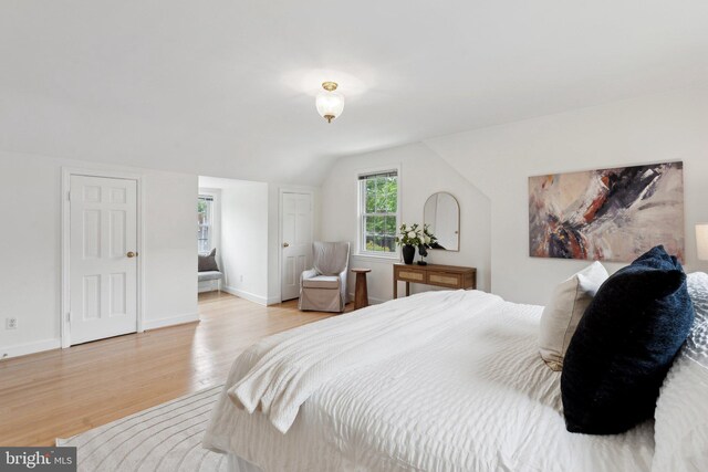 1725 Oakcrest Dr, Alexandria, VA 22302 - bedroom featuring light wood finished floors, lofted ceiling, and baseboards