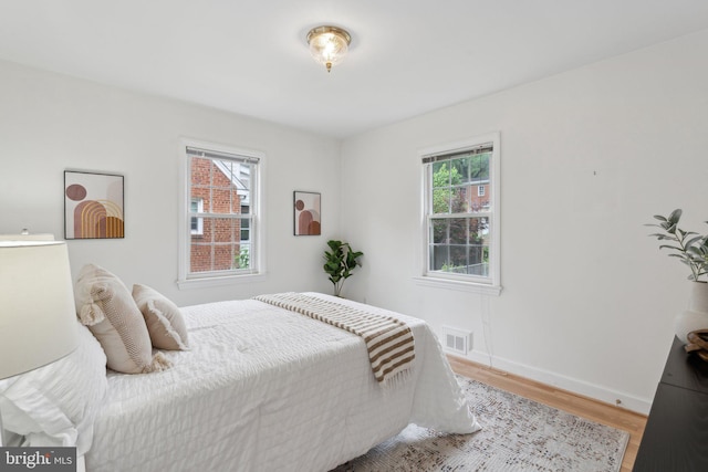 1725 Oakcrest Dr, Alexandria, VA 22302 - bedroom featuring wood finished floors and baseboards