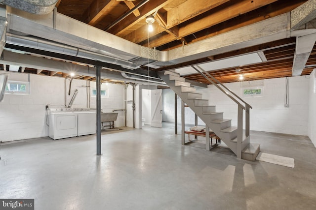 1725 Oakcrest Dr, Alexandria, VA 22302 - basement featuring washer and clothes dryer, stairs, and concrete block wall