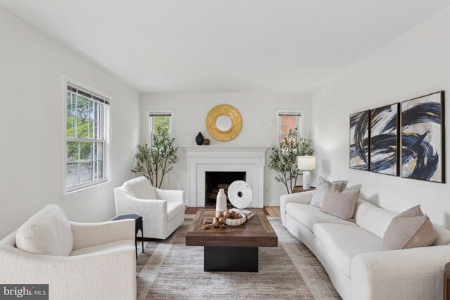 1725 Oakcrest Dr, Alexandria, VA 22302 - living room with wood finished floors and a brick fireplace