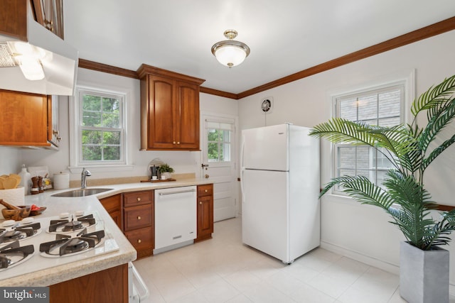 1725 Oakcrest Dr, Alexandria, VA 22302 - kitchen featuring white appliances, a sink, light countertops, brown cabinetry, and ornamental molding