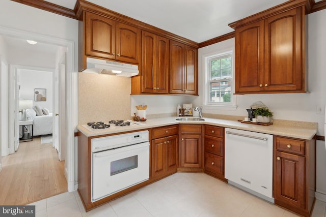 1725 Oakcrest Dr, Alexandria, VA 22302 - kitchen with white appliances, under cabinet range hood, and brown cabinetry