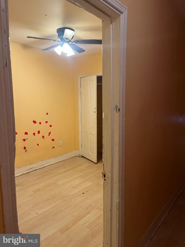 2412 N Corlies St, Philadelphia, PA 19132 - empty room with light wood-style floors, ceiling fan, and baseboards