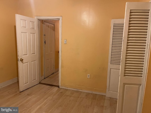 2412 N Corlies St, Philadelphia, PA 19132 - unfurnished bedroom featuring light wood-style flooring, baseboards, and a closet