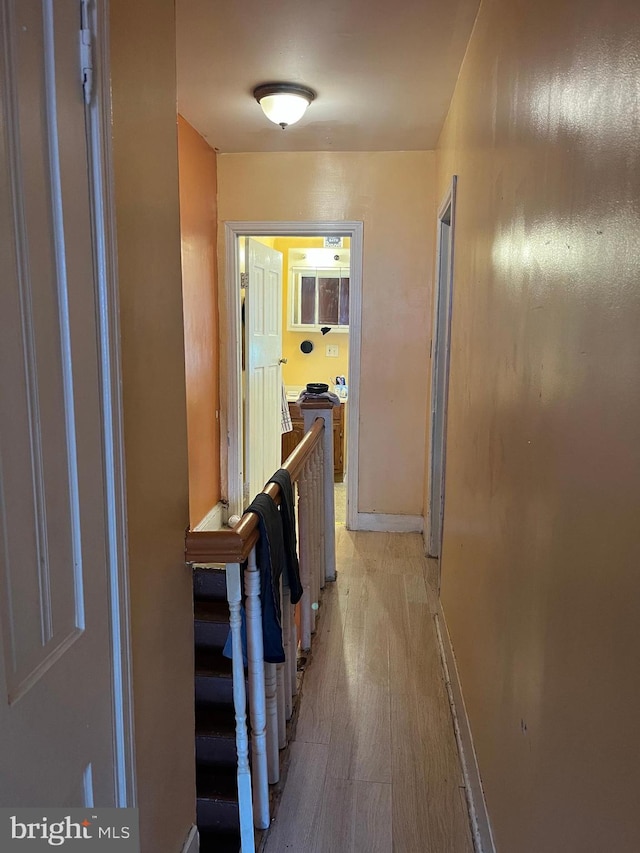 2412 N Corlies St, Philadelphia, PA 19132 - hallway featuring baseboards and light wood finished floors