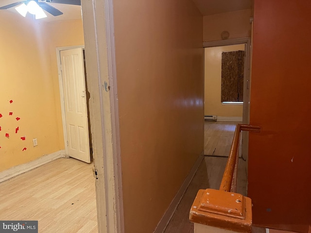 2412 N Corlies St, Philadelphia, PA 19132 - hall featuring wood finished floors, baseboards, and baseboard heating