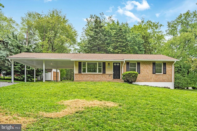 view of front facade featuring brick siding, a front lawn, a shed, and an outdoor structure