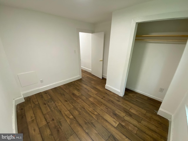 2546 N Marston St, Philadelphia, PA 19132 - unfurnished bedroom featuring dark wood finished floors, a closet, and baseboards