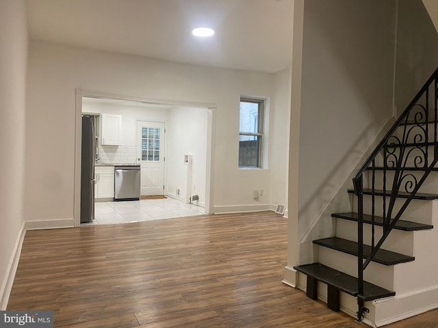 2546 N Marston St, Philadelphia, PA 19132 - stairway with wood finished floors, baseboards, plenty of natural light, and recessed lighting