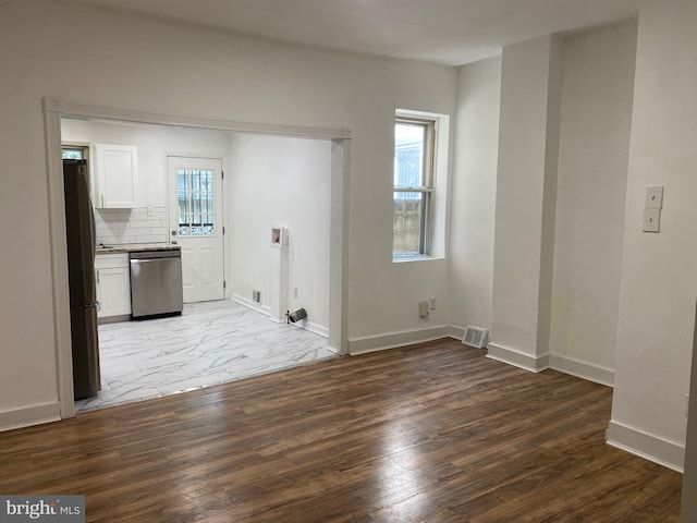 2546 N Marston St, Philadelphia, PA 19132 - unfurnished living room with wood finished floors and baseboards