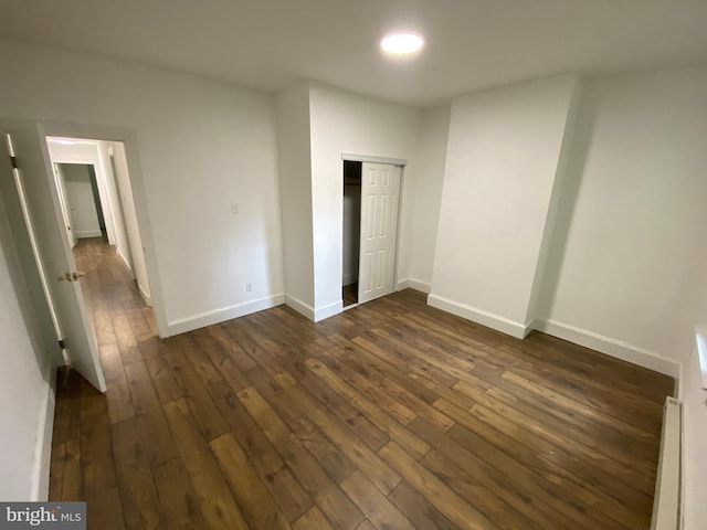 2546 N Marston St, Philadelphia, PA 19132 - unfurnished bedroom with dark wood-style flooring, baseboards, and a closet