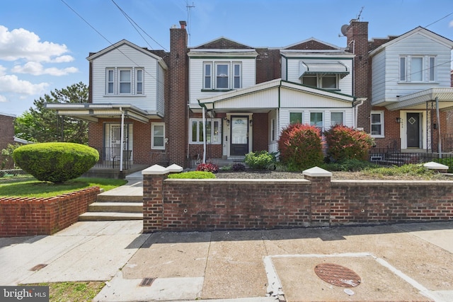 view of property featuring brick siding