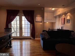 living room featuring wood finished floors and baseboards